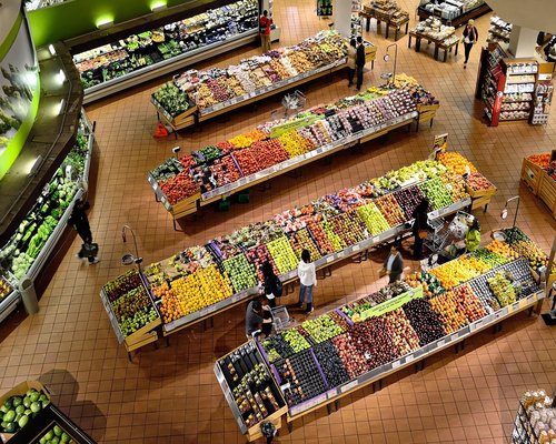 A colorful display of fresh fruits and vegetables at a Mexican street market